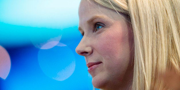Marissa Mayer, president and chief executive officer of Yahoo! Inc., watches a demonstration during the DreamForce Conference in San Francisco, California, U.S., on Tuesday, Nov. 19, 2013. Yahoo boosted its stock-buyback plan by $5 billion, returning more cash to shareholders as Mayer seeks to revive growth at the largest U.S. Internet portal. Photographer: David Paul Morris/Bloomberg via Getty Images