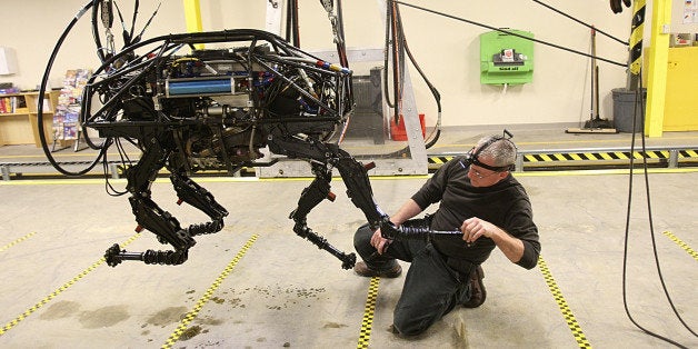 WALTHAM, MA - FEBRUARY 3: A BigDog robot at Boston Dynamics. Innovation Economy column on local robotics company called Boston Dynamics, which mainly does military contracting work - they just won a big contract this week from the Department of Defense. One of their robots, called BigDog, is being developed to help soldiers carry heavy equipment in the field -- it can literally follow a human being, walking across wet/sandy/rocky terrain, just like a dog would. (Photo by Suzanne Kreiter/The Boston Globe via Getty Images)