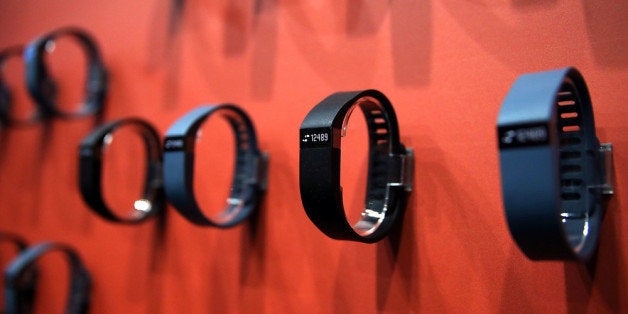 LAS VEGAS, NV - JANUARY 07: The Fitbit Force is displayed in the Fitbit booth at the 2014 International CES at the Las Vegas Convention Center on January 7, 2014 in Las Vegas, Nevada. CES, the world's largest annual consumer technology trade show, runs through January 10 and is expected to feature 3,200 exhibitors showing off their latest products and services to about 150,000 attendees. (Photo by Justin Sullivan/Getty Images)