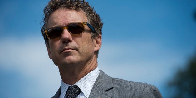 UNITED STATES - SEPTEMBER 26: Sen. Rand Paul, R-Ky., listens at the House Triangle during the Coal Caucus' news conference on the EPA's recently proposed greenhouse gas standards for new power plants on Thursday, Sept. 26, 2013. (Photo By Bill Clark/CQ Roll Call)