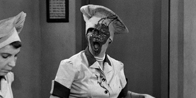 American actresses Amanda Milligan (left), as Candy Dipper, and Lucille Ball (1911 - 1989), covered in chocolate as Lucy Ricardo, work side-by side in a candy factory in an episode of the television comedy 'I Love Lucy' entitled 'Job Switching,' Los Angeles, California, May 30, 1952. The episode was originally broadcast as the opening episode of the show's second season, on September 15, 1952. (Photo by CBS Photo Archive/Getty Images)