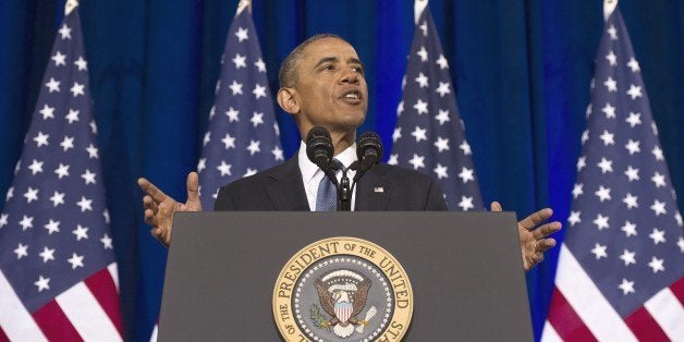 US President Barack Obama speaks about the National Security Agency (NSA) and intelligence agencies surveillance techniques at the US Department of Justice in Washington, DC, January 17, 2014. Obama trimmed the powers of the secretive US eavesdropping agency Friday by calling for new privacy safeguards, but allowed bulk phone data sweeps to continue as an anti-terror tool. In a long-awaited speech outlining changes to programs exposed by Edward Snowden, Obama also said he had halted National Security Agency (NSA) spy taps targeting friendly world leaders. AFP PHOTO / Jim WATSON (Photo credit should read JIM WATSON/AFP/Getty Images)