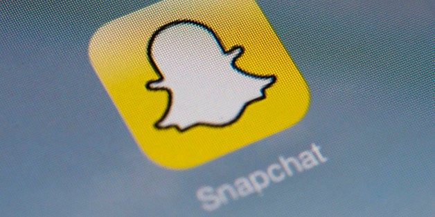 The logo of mobile app 'Snapchat' is displayed on a tablet on January 2, 2014 in Paris. Hackers broke into Snapchat, the huge
