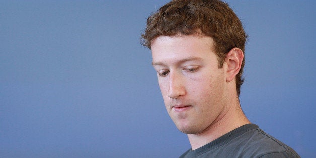 SAN FRANCISCO - NOVEMBER 15: Facebook founder and CEO Mark Zuckerberg pauses as he speaks during a special event announcing