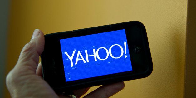 This September 12, 2013 photo illustration shows the newly designed Yahoo logo seen on a smartphone. Yahoo has refreshed its logo for the first time since the Internet companys founding 18 years ago. The new look unveiled September 4 is part of a makeover that Yahoo Inc. has been undergoing since the Sunnyvale, California company hired Google executive Marissa Mayer to become Yahoos CEO. AFP PHOTO / Karen BLEIER (Photo credit should read KAREN BLEIER/AFP/Getty Images)