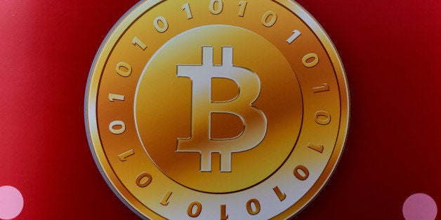 A bitcoin logo is seen during the opening ceremony of the first bitcoin retail shop in Hong Kong on February 28, 2014. Bitcoi