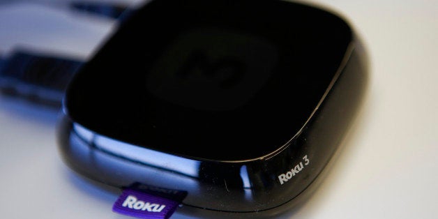 A Roku 3 television streaming player is arranged for a photograph in Los Angeles, California, U.S., on Thursday, Sept. 12, 2013. Roku Inc. announced an all-new family of streaming players, Roku LT, Roku 1 and Roku 2, which are designed to provide a better TV experience. Photographer: Patrick T. Fallon/Bloomberg via Getty Images