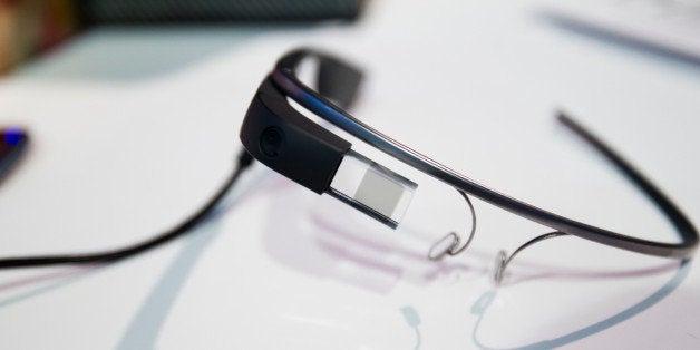 A pair of Google Glass connected glasses sits on display on day three of the Mobile World Congress in Barcelona, Spain, on Wednesday, Feb. 26, 2014. Top telecommunication managers will rub shoulders in Barcelona this week at the Mobile World Congress, Monday, Feb. 24 - 27, a traditional venue for showcasing the latest products for dealmaking. Photographer: Angel Navarrete/Bloomberg via Getty Images