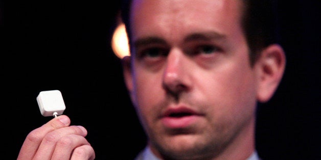 DETROIT, MI - SEPTEMBER 12: Jack Dorsey, Chairman of Twitter and CEO of Square, holds up a Square credit card reader as he speaks at TECHONOMYDETROIT September 12, 2012 in Detroit, Michigan. The event, hosted by the Detroit Economic Club is a one-day multidisciplinary gathering of national and local leaders about reigniting U.S. competitiveness, creating jobs, and revitalizing our cities in a technologized age. (Photo by Bill Pugliano/Getty Images)