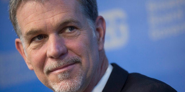 Reed Hastings, chairman, president and chief executive officer of Netflix Inc., listens during a Broadcasting Board of Governors (BBG) panel discussion in Washington, D.C., U.S., on Wednesday, Dec. 18, 2013. Technology company executives including Hastings left a meeting with President Barack Obama yesterday with no commitment to limit government snooping on Internet traffic, according to an industry official briefed on the session. Photographer: Andrew Harrer/Bloomberg via Getty Images