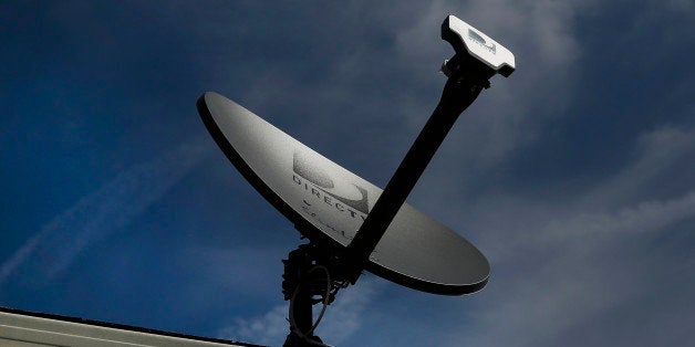 A DirecTV satellite dish stands on the roof of a home in Compton, California, U.S., on Monday, May 5, 2014. DirecTV beat analysts' first-quarter profit estimates on higher bills for U.S. customers and more subscriber sign-ups than expected in Latin America. Photographer: Patrick T. Fallon/Bloomberg via Getty Images