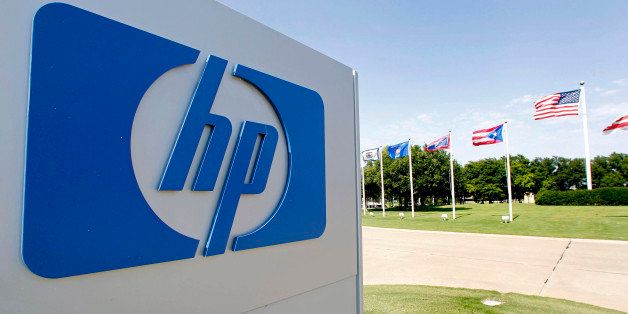The Hewlett-Packard Co. logo is displayed outside the company's HP Enterprise Services unit in Plano, Texas, U.S., on Wednesday, May 23, 2012. Hewlett-Packard, the world's largest PC maker, will cut 27,000 jobs, or about 8 percent of its staff. Many of the cuts will come from the ailing enterprise services group, which manages data centers and provides technology consulting. Photographer: Mike Fuentes/Bloomberg via Getty Images