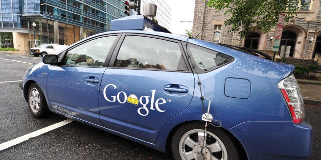 The Google self-driving car maneuvers through the streets of in Washington, DC May 14, 2012. The system on a modified Toyota Prius combines information gathered from Google Street View with artificial intelligence software that combines input from video cameras inside the car, a LIDAR sensor on top of the vehicle, radar sensors on the front of the vehicle and a position sensor attached to one of the rear wheels that helps locate the car's position on the map. As of 2010, Google has tested several vehicles equipped with the system, driving 1,609 kilometres (1,000 mi) without any human intervention, in addition to 225,308 kilometres (140,000 mi) with occasional human intervention. Google expects that the increased accuracy of its automated driving system could help reduce the number of traffic-related injuries and deaths, while using energy and space on roadways more efficiently. AFP PHOTO/Karen BLEIER (Photo credit should read KAREN BLEIER/AFP/GettyImages)