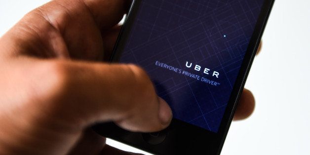 BARCELONA, SPAIN - JULY 01: In this photo illustration, the app 'Uber' is launched in a smart phone on July 1, 2014 in Barcelona, Spain. Taxi drivers in main cities strike over unlicensed car-halling services. Drivers say that is a lack of regulation behind the new app. (Photo Illustration by David Ramos/Getty Images)