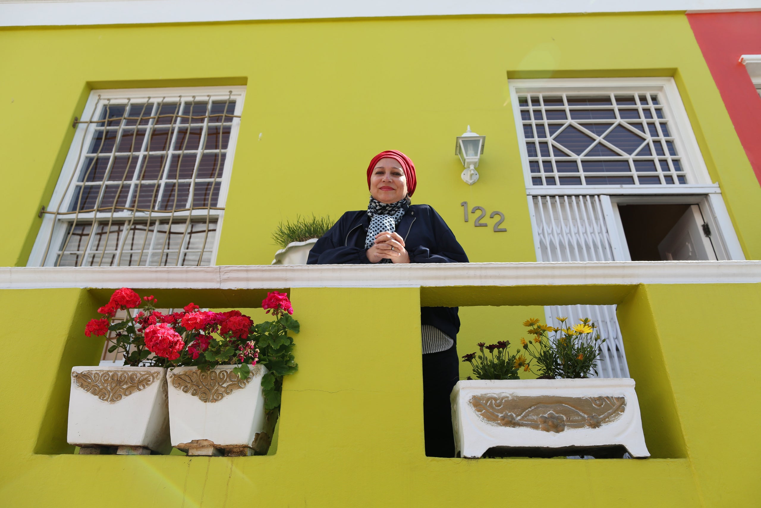 Rashida Emeran poses for a photo outside her house in Bo-Kaap.<i></i>