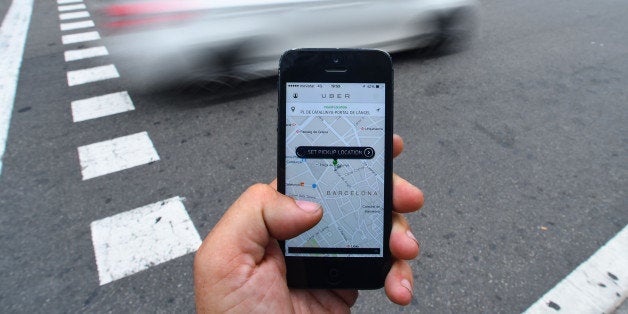 BARCELONA, SPAIN - JULY 01: In this photo illustration the new smart phone taxi app 'Uber' shows how to select a pick up location on July 1, 2014 in Barcelona, Spain. Taxi drivers in various cities have been on strike over unlicensed car-hailing services. Drivers say that there is a lack of regulation behind the new app. (Photo by David Ramos/Getty Images)