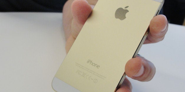 New iPhone 5S will come in a gold color as well as 'space gray.' shows at an iPhone event at Apple's headquarters in Silicon
