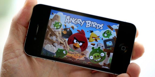 The ''Angry Birds'' mobile-phone game, designed by Rovio Mobile Oy is seen on an Apple Inc. iPhone 4 smartphone in this arranged photograph in London, U.K., on Wednesday, Aug. 29, 2012. Apple Inc. is seeking a U.S. sales ban on eight models of Samsung Electronics Co. smartphones and the extension of a preliminary ban on a tablet computer after winning a patent trial against the South Korean company. Photographer: Chris Ratcliffe/Bloomberg via Getty Images