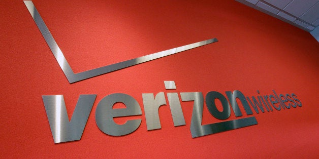 FILE- In this Tuesday, June 12, 2012, file photo, the Verizon logo is seen at Verizon store in Mountain View, Calif. Verizon