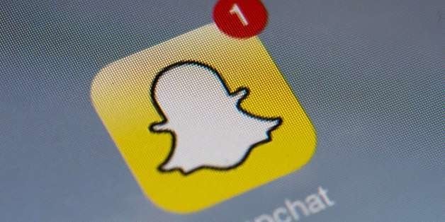 The logo of mobile app 'Snapchat' is displayed on a tablet on January 2, 2014 in Paris. Hackers broke into Snapchat, the huge
