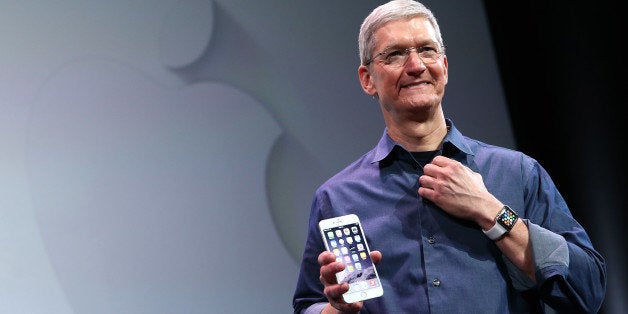 CUPERTINO, CA - SEPTEMBER 09: Apple CEO Tim Cook shows off the new iPhone 6 and the Apple Watch during an Apple special event at the Flint Center for the Performing Arts on September 9, 2014 in Cupertino, California. Apple is expected to unveil the new iPhone 6 and wearble tech. (Photo by Justin Sullivan/Getty Images)