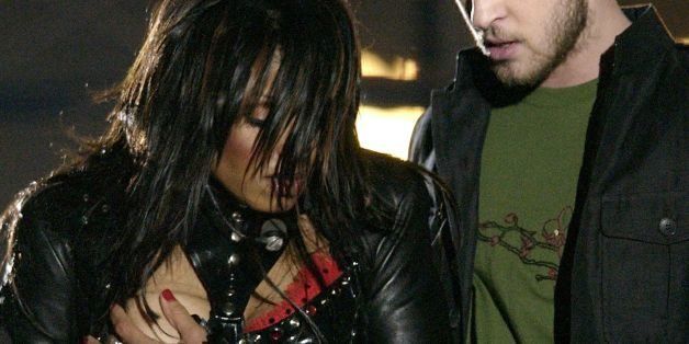 **FOR USE WITH AP LIFESTYLES** **FILE** In a Sunday Feb. 1, 2004 file photo, entertainer Janet Jackson, left, covers her breast after her outfit came undone during the half time performance with Justin Timberlake at Super Bowl XXXVIII in Houston. A federal appeals court in Philadelphia threw out out a $550,000 fine issued by the Federal Communications Commission against CBS Corp. Monday, July 21, 2008, for the 2004 Super Bowl halftime show that ended with Janet Jackson's breast-baring "wardrobe malfunction."(AP Photo/David Phillip, File)