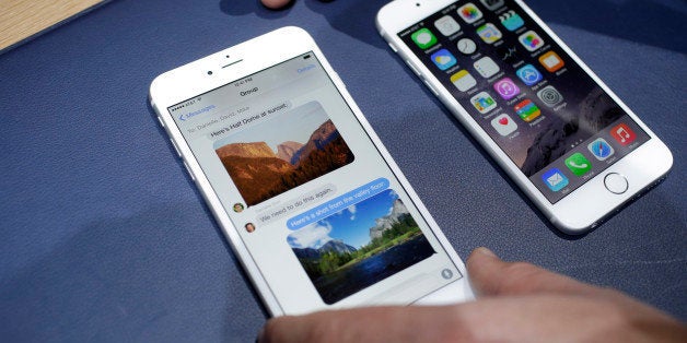 The iPhone 6 plus, left, and iPhone 6 are displayed on Tuesday, Sept. 9, 2014, in Cupertino, Calif. (AP Photo/Marcio Jose San