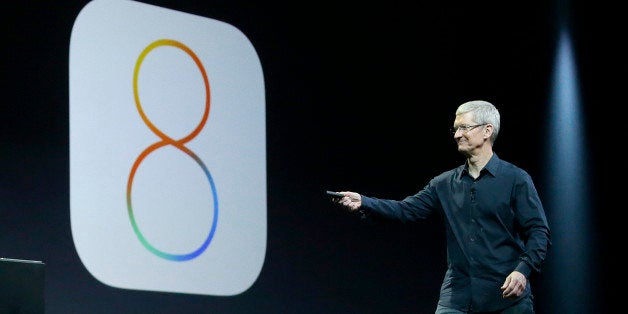 Apple CEO Tim Cook speaks about iOS 8 at the Apple Worldwide Developers Conference in San Francisco, Monday, June 2, 2014. (AP Photo/Jeff Chiu)