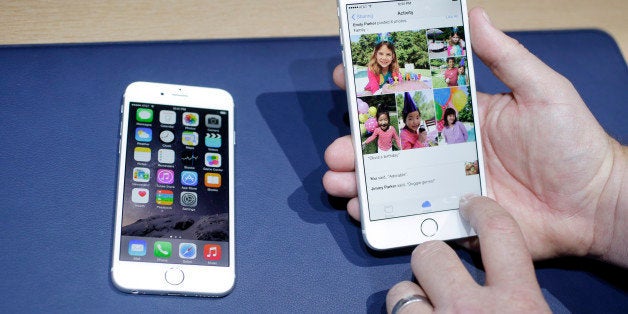 FILE - This Sept. 9, 2014 file photo shows the iPhone 6, at left, and iPhone 6 plus during a new product release in Cupertino