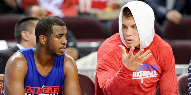 Los Angeles Clippers guard Chris Paul (3) talks with forward Blake Griffin, right, during an NBA basketball scrimmage, Sunday, Dec. 18, 2011, in Los Angeles. (AP Photo/Gus Ruelas)