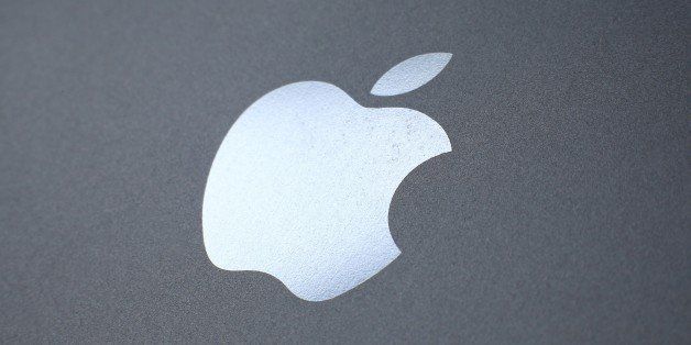 LONDON, ENGLAND - AUGUST 06: An Apple logo is seen on the back on a smartphone on August 6, 2014 in London, England. Smartphone and tablet manufacturers Samsung and Apple have agreed to end all legal cases over patent infringements outside of the US. (Photo by Peter Macdiarmid/Getty Images)