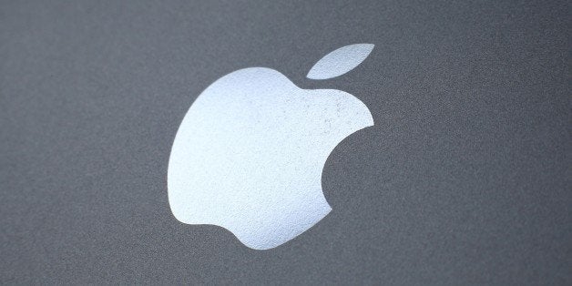 LONDON, ENGLAND - AUGUST 06: An Apple logo is seen on the back on a smartphone on August 6, 2014 in London, England. Smartph