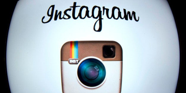 The Instagram logo is displayed on a tablet on December 20, 2012 in Paris. Instagram backed down on December 18, 2012 from a planned policy change that appeared to clear the way for the mobile photo sharing service to sell pictures without compensation, after users cried foul. Changes to the Instagram privacy policy and terms of service set to take effect January 16 had included wording that appeared to allow people's pictures to be used by advertisers at Instagram or Facebook worldwide, royalty-free. AFP PHOTO / LIONEL BONAVENTURE (Photo credit should read LIONEL BONAVENTURE/AFP/Getty Images)