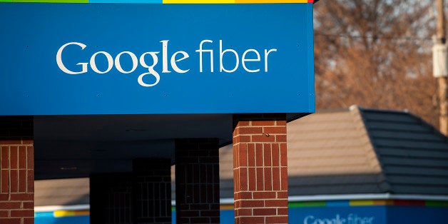 Google Inc. Fiber signage is displayed outside of the company's office in Kansas City, Missouri, U.S., on Tuesday, Nov. 27, 2012. Google Inc. will move a step closer to offering the fastest citywide Internet service in the U.S. when it picks the first neighborhoods in Kansas City to get hooked into a new fiber-optic network. Photographer: Julie Denesha/Bloomberg via Getty Images