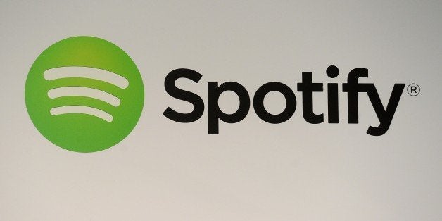 A Spotify logo is seen as founder and CEO Daniel Ek addresses a press conference in New York, December 11, 2013. The music streaming service, Spotify, unveiled a new ad-based service for mobile and tablet users that will allow access to Spotify's song catalog for free. Ek also announced, that the Spotify catalog will now include the works of Led Zeppelin, the legendary band that until this deal had withheld its music from streaming services. AFP PHOTO/Emmanuel Dunand (Photo credit should read EMMANUEL DUNAND/AFP/Getty Images)