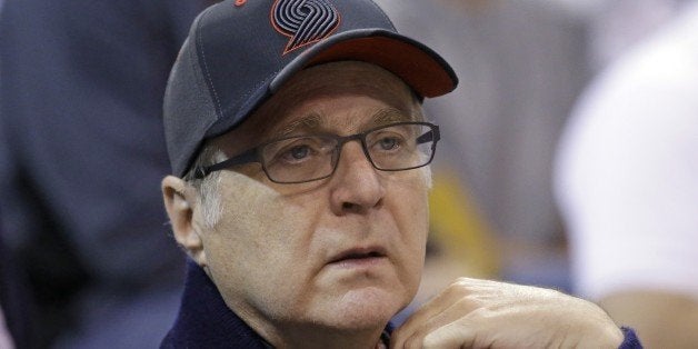 Portland Trail Blazers owner Paul Allen looks on before the start of their NBA preseason basketball game against the Utah Jazz Tuesday, Oct. 7, 2014, in Salt Lake City. (AP Photo/Rick Bowmer)