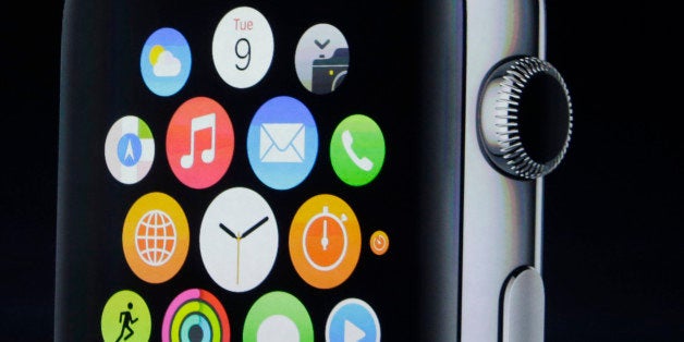 Apple CEO Tim Cook introduces Apple Watch on Tuesday, Sept. 9, 2014, in Cupertino, Calif. (AP Photo/Marcio Jose Sanchez)