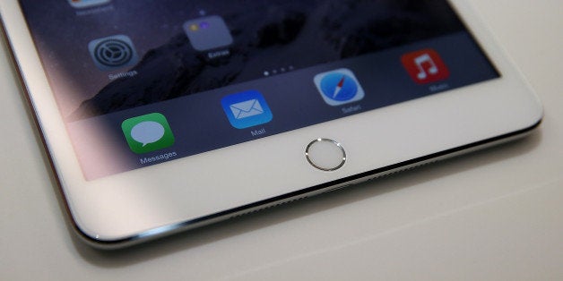 CUPERTINO, CA - OCTOBER 16: A touch I.D. pad is seen on the new iPad Mini 3 during an Apple special event on October 16, 201