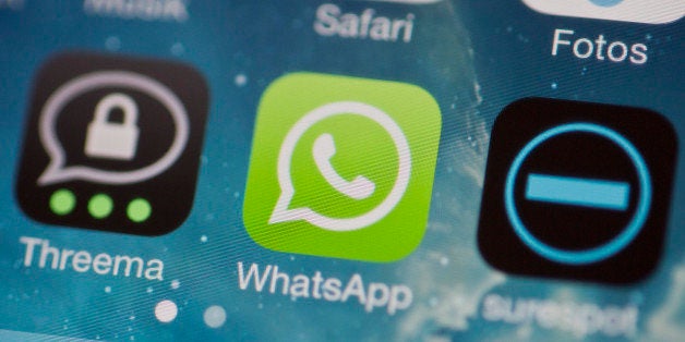 BERLIN, GERMANY - FEBRUARY 24: The icons of the messenger apps Whatsapp, Surespot and Threema on a display of a cellphone on