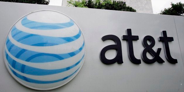 The AT&T logo is seen on one of it's buildings in San Antonio, Monday, April 23, 2007. Telecommunications heavyweight AT&T Inc. said Tuesday, April 24, 2007 its profit doubled to $2.8 billion in the first three months of the year, its first full quarter since completing its acquisition of BellSouth. (AP Photo/Eric Gay)