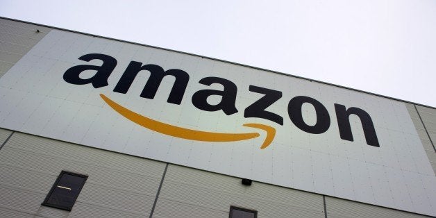 The logo of US online retail giant Amazon is displayed on the Brieselang logistics center, west of Berlin on November 11, 2014. The center is one of nine in Germany. AFP PHOTO / JOHN MACDOUGALL (Photo credit should read JOHN MACDOUGALL/AFP/Getty Images)