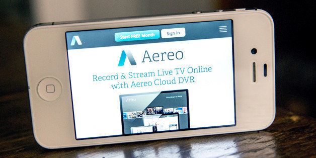 NEW YORK, NY - APRIL 22: In this photo illustration, Aereo.com, a web service that provides television shows online, is shown on an iPhone 4S on April 22, 2014 in New York City. Aereo is going head-to-head against ABC, a major television network, in a court case being heard by the Supreme Court. (Photo Illustration by Andrew Burton/Getty Images)