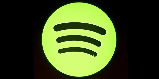 A Spotify logo is seen as founder and CEO Daniel Ek addresses a press conference in New York, December 11, 2013. The music streaming service, Spotify, unveiled a new ad-based service for mobile and tablet users that will allow access to Spotify's song catalog for free. Ek also announced, that the Spotify catalog will now include the works of Led Zeppelin, the legendary band that until this deal had withheld its music from streaming services. AFP PHOTO/Emmanuel Dunand (Photo credit should read EMMANUEL DUNAND/AFP/Getty Images)