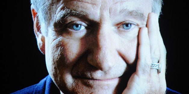 Robin Williams seen on screen during an In Memoriam tribute at the 66th Primetime Emmy Awards at the Nokia Theatre L.A. Live