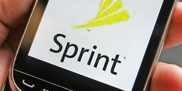 In this Monday, July 29, 2013, photo, a Sprint logo is displayed on a smart phone in Montpelier, Vt. In revamping its prices and plans this week, Sprint is joining Verizon and AT&T in letting families share pools of data. (AP Photo/Toby Talbot, File)