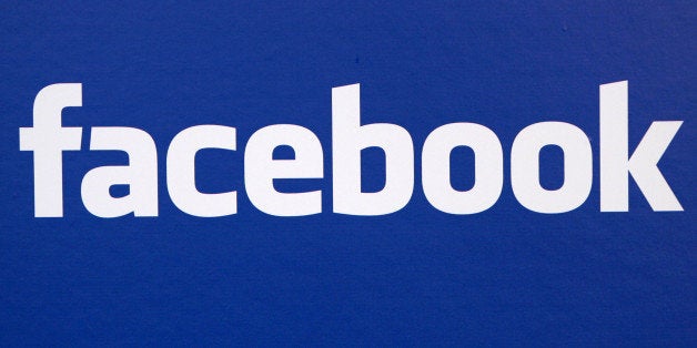 FILE - In this Nov. 6, 2007 file photo, the Facebook logo is displayed at a Facebook announcement in New York. A report in th