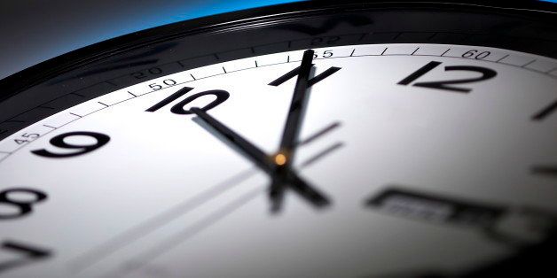 minute hour second hand timeclock late hour black and white clock on a dark blue background (Photo by: Digital Light Source/UIG via Getty Images)