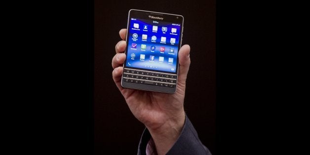Ron Louks, president of devices at BlackBerry Ltd., displays the Classic mobile device while speaking at a press conference during the 2015 Consumer Electronics Show (CES) in Las Vegas, Nevada, U.S., on Wednesday, Jan. 7, 2015. BlackBerry Ltd., working to win back investor confidence, unveiled the first part of its plan to compete in the emerging world of Web-connected electronics with a platform that keeps track of shipping containers and vehicles. Photographer: David Paul Morris/Bloomberg via Getty Images