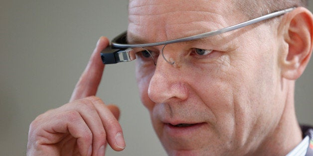 HELSINKI, FINLAND - DECEMBER 01: A guest uses a Google glass during the Eurobest festival of creativity at Finlandia Hall on December 1, 2014 in Helsinki, Finland. (Photo by Andreas Rentz/Getty Images for Eurobest)