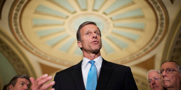 UNITED STATES - FEBRUARY 25: Sen. John Thune, R-S.D., talks with the media after the senate luncheons in the Capitol. Sens. R